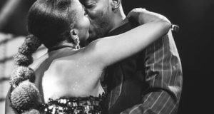Adekunle Gold gives Simi a kiss after his concert
