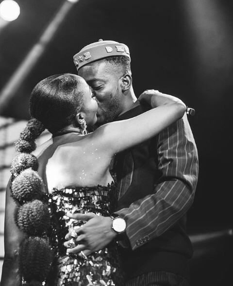 Adekunle Gold gives Simi a kiss after his concert